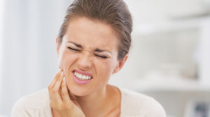 Woman with Toothache Needing an Emergency Dentist